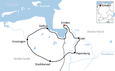 Karte mit Radweg durch Niederlande und Deutschland, der Emden, Leer, Papenburg, Stadskanaal, Groningen und Delfzijl entlang von Wasserstraßen verbindet.