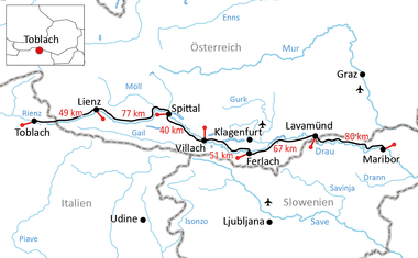 Karte des Drau-Radwegs von Toblach nach Maribor über Lienz, Spittal, Villach, Klagenfurt und Lavamünd mit rot markierten Entfernungen.